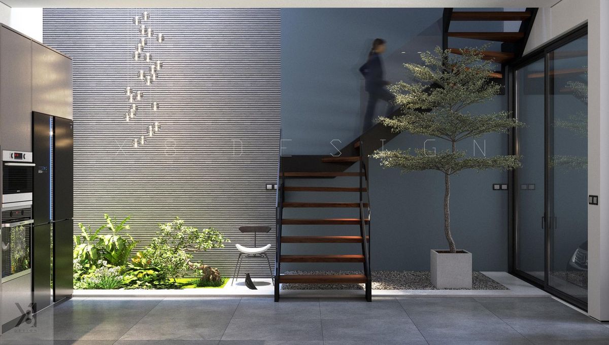Thiết kế nhà phố có giếng trời và vườn trong nhà dưới cầu thang - X8Design